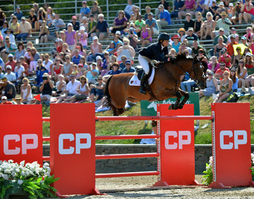 Beezie Madden, of Cazenovia, New York, and Abigail Wexner's Simon claim the CP $1 Million Grand Prix FEI CSI-5*, presented by Wells Fargo. Photo (C) ESI Photography. 