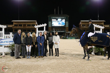 Paige Johnson and Luke Skywalker 46 in their presentation ceremony with Mark Bellissimo, Paige Bellissimo, Lauren Tisbo, Jeannie Tisbo, Tom Tisbo, Roger Smith, Ramona Holloway, and Jennifer Smith.