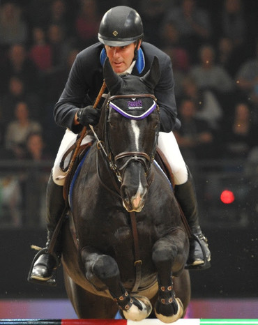 William Funnell and Billy Congo won the 1.50-metre jump-off class, sponsored by Horse & Hound. Photo (c) Trevor Meeks. 