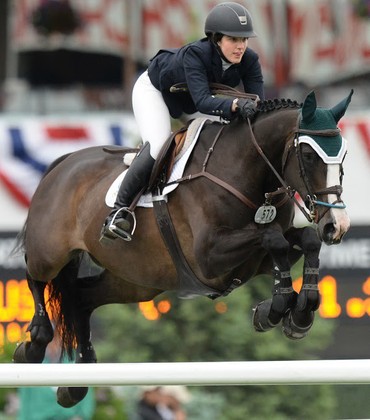 Kelli Cruiciotti and Chamonix H in the Encana U25 Cup. Photo (c) Spruce Meadows Media Services.