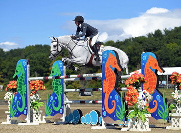 Ali Wolff and Caya on their way to a $34,600 Saugerties Jumper Classic win. Photo (c) ESI Photography.
