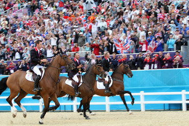 The British team in front of the crowds in Greenwich Park celebrating the gold. Photo by © 2012 Ken Braddick/dressage-news.com.