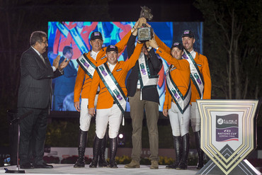 The Netherlands' team celebrate victory in the Furusiyya FEI Nations Cup™ Jumping 2014 Final in Barcelona, Spain tonight. (L to R), HRH Prince Faisal of Saudi Arabia and Dutch team members Jeroen Dubbeldam, Gerco Schroder, Chef d'Equipe Rob Ehrens, Maikel van der Vleuten and Jur Vrieling. (FEI/Dirk Caremans)