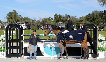 (c) ESI Photography Tracy Fenney and MTM Centano with a Horze cooler and the blue ribbon in the $50,000 HITS Grand Prix. 