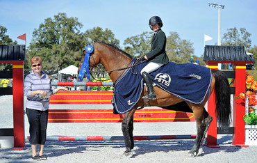 Kaitlin Campbell and her Rocky W get the blue ribbon in the $25,000 SmartPak Grand Prix at HITS Ocala. Photo (c) ESI Photography.