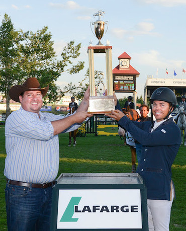 Kent Farrington celebrates his victory with Jonathan Moser, Director, Environment & Public Affairs, Lafarge. Photo © Spruce Meadows Media Services.