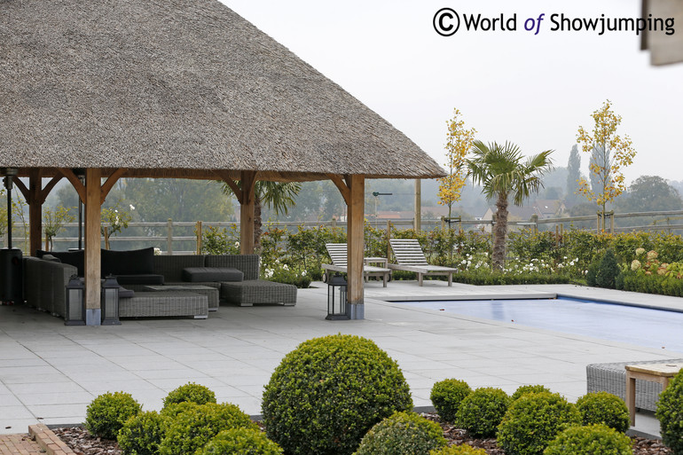 The lounge and pool area behind the house