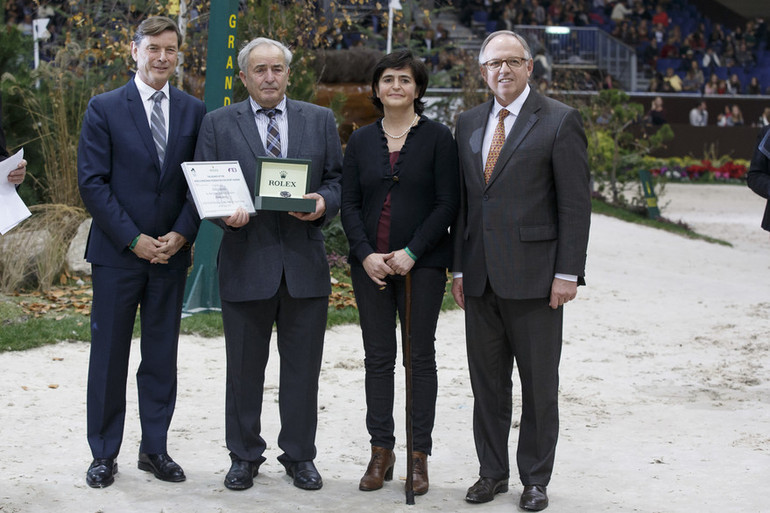 Willy Taets, (BEL) , breeder of Hello Sanctos (sBs), (Quasimodo vd Molendreef - Nasia vd Gravenhof x Nabab de Rêve) with Dr Marc Pierson, president of SBS. Receiving a Rolex watch from Mr. Laurent Delonney, Directeur adjoint Sponsoring WBSFH Prizegiving. Photo (c) Dirk Caremans/www.hippofoto.be.