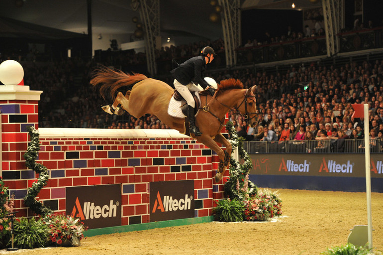 Jos Verlooy and Sunshine flying the 2.15 m wall at Olympia. Photo (c) Kit Houghton/Hpower.