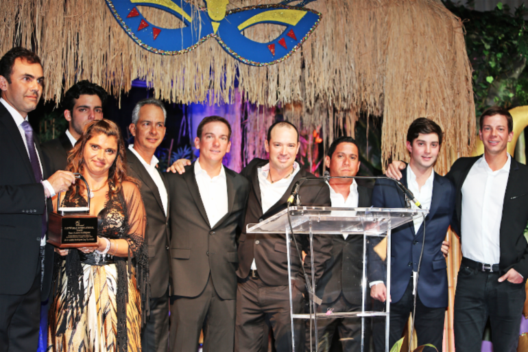 Juan Andres Rodriguez, Jessica Newman, Emanuel Andrade, Pablo Barrios, Alejandro Karolyi, Juan Ortiz, Victor Segovia, Luis Larrazabal, and Angel Karolyi on stage at the 13th Annual JustWorld Gala presented by Wellington Masters. Photo (c) Steven Michael King.