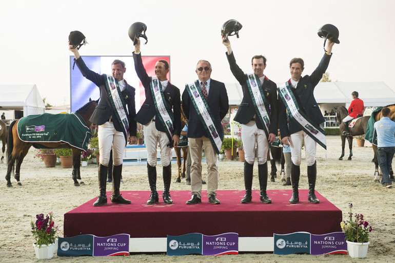 The French team of Mathieu Billot, Frederic David, Julien Gonin and Jerome Hurel pictured with Chef d’Equipe Philippe Guerdat after victory in the opening leg of the Furusiyya FEI Nations Cup 2016 series in Al Ain. Photo (c) FEI/Richard Juillart.