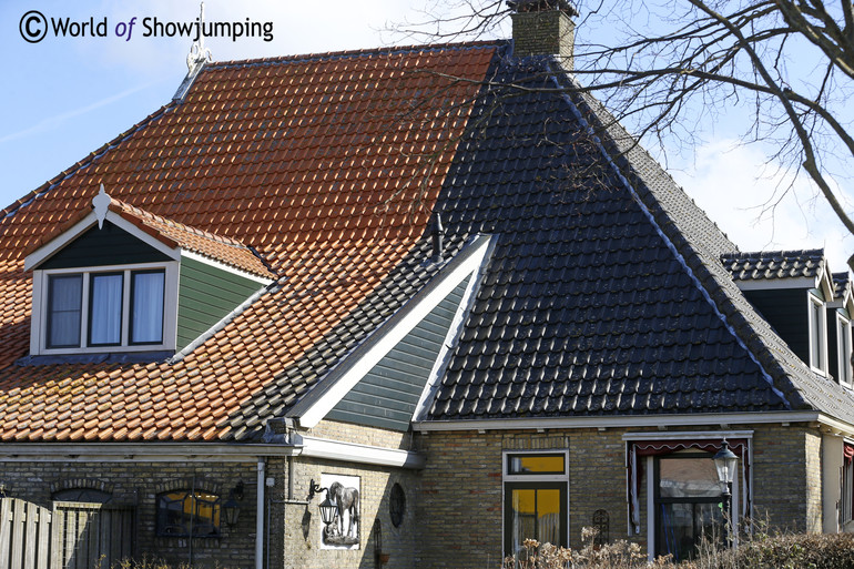 Back in the days the color of the roof showed in which part the people lived and which part that was for the animals. 