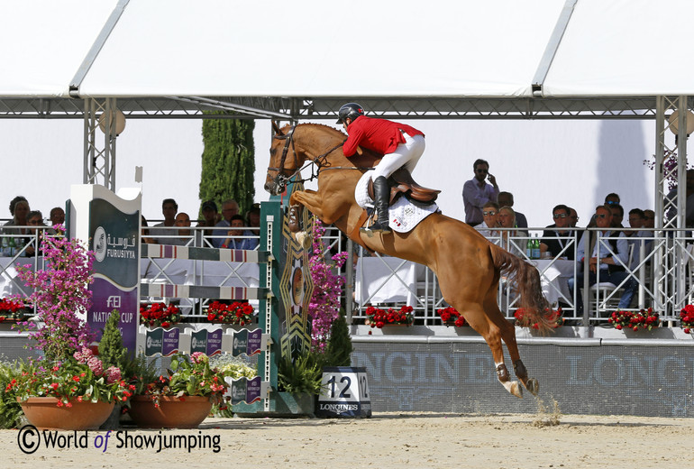 Eric Lamaze's Chacco Kid flying over the last fence. 