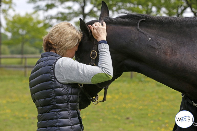 Beezie pictured in a quiet moment with one of her top horses Cortes 'C'. Photo (c) Jenny Abrahamsson.