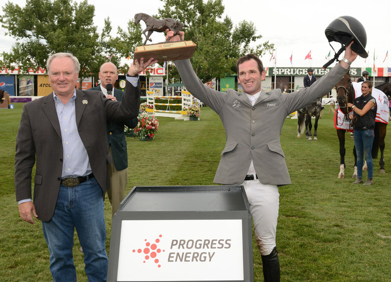 Philipp Weishaupt hoists the Champions Trophy with Michael Culbert, President and CEO, Progress Energy.