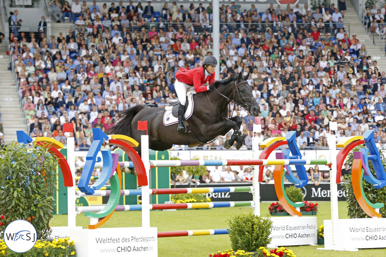 Just love the way Cortes 'C' is jumping with his front legs. Beezie Madden finished 7th and was one of very few that got around the first course without time faults. 