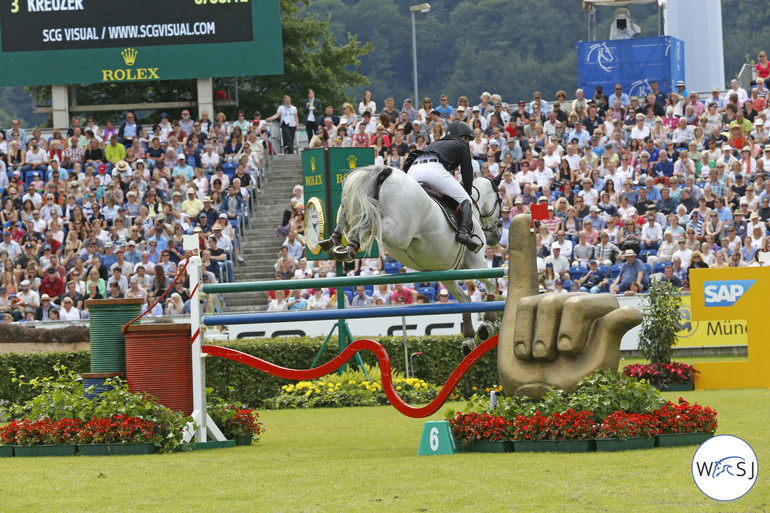 Gerco Schröder and Glock's Cognac Champblanc over one of Aachen's beautiful fences. 