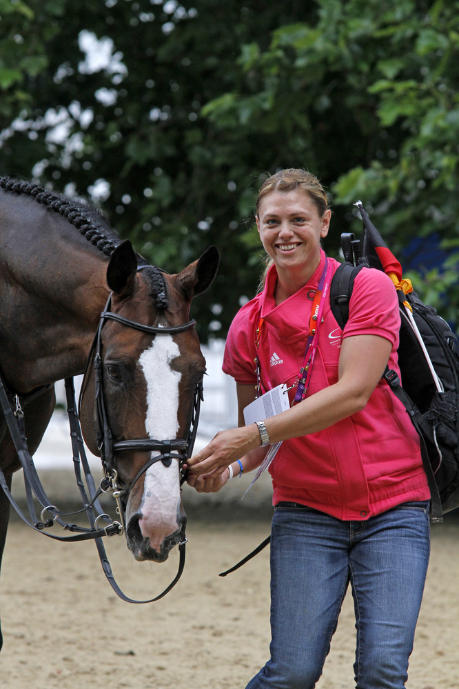 Happy horse, happy groom - Marcus Ehning's Plot Blue and Kay Neatham.