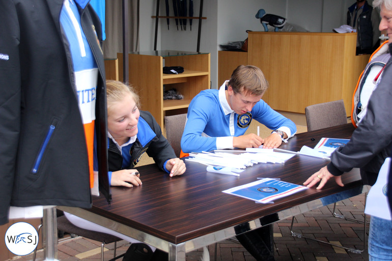 Emily Moffatt and Bertram Allen signing autographs. Photo (c) World of Showjumping.