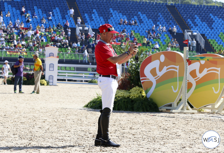 Eric Lamaze taking pictures of the fences. 