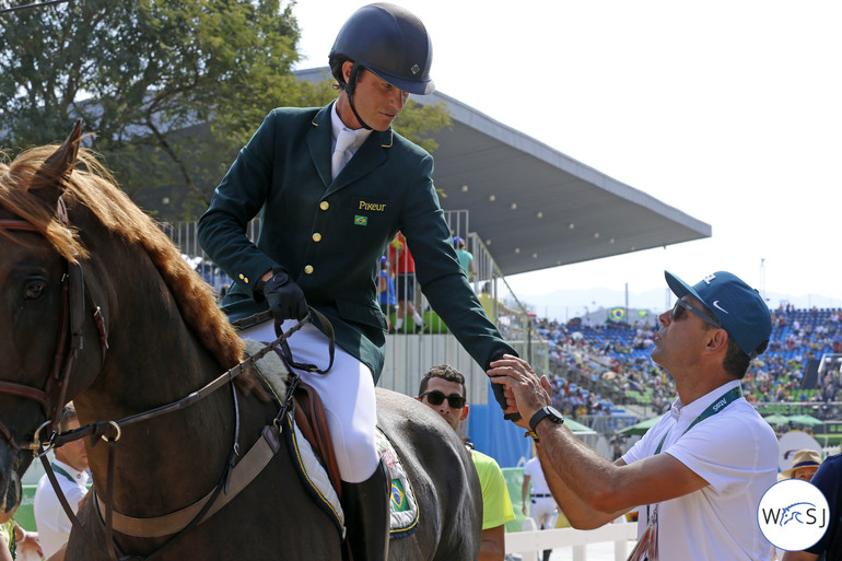 Pedro Veniss delivered Brazil's third clear round, here being congratulated by team mate Doda de Miranda. 