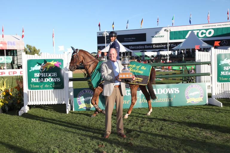 Sameh El Dahan and WKD Diva pose with Tom Gardiner at the Spruce Meadows Signature Fence. Photo (c) Spruce Meadows Media Services.