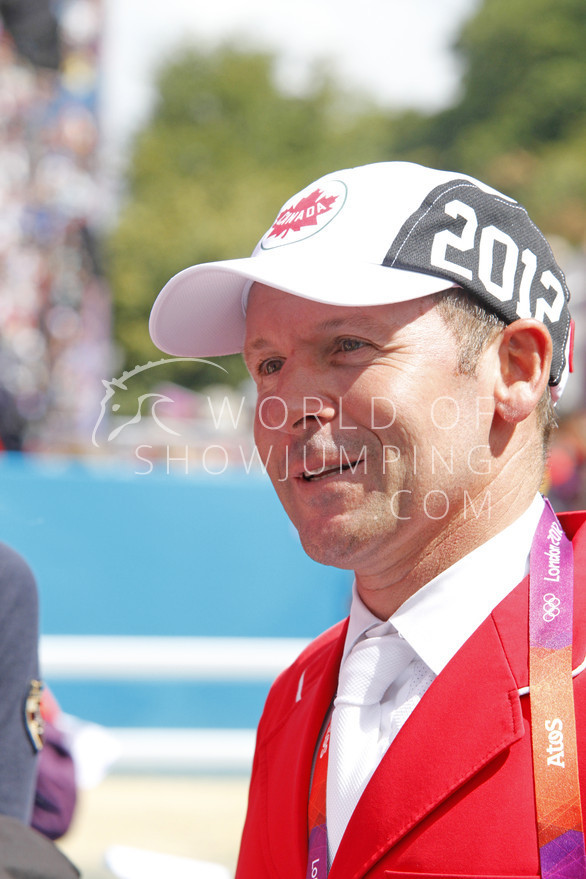 Reigning Olympic champion Eric Lamaze talking to the press after his ride which resulted in a clear round. 