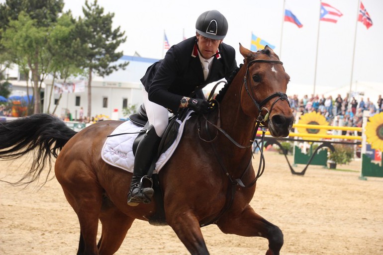 Johannes Ehning and Cayenne give everything through the finish line, to take the win in Mannheim. Photo (c) World of Showjumping.