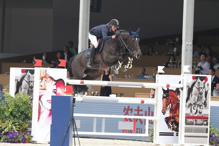 Gregory Wathelet and Oh d'Eole won Sunday's biggest class in Shanghai. Photo (c) Stefano Grasso/LGCT.