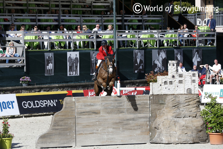 Jos Lansink's Aganix du Seigneur tripped in the landing after this jump and the two of them had to retire.