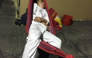 Lisa catching some sleep after taking care of the horses on the flight!