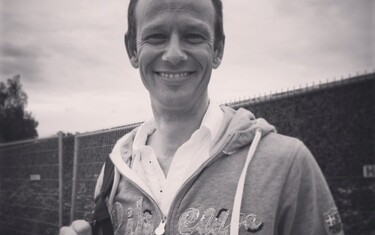 Marco wearing a winner's smile