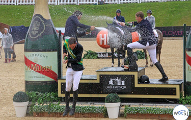 The riders on the podium soaked each other in champagne after the Grand Prix. 