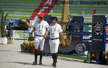 Colombia's Daniel Bluman gets some advice from his trainer Eric Lamaze, who competes for Canada.