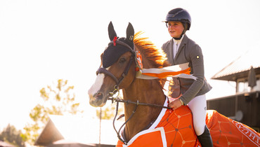 Emmeline Adamick captures first FEI win with Andy’s Boy Bretoniere