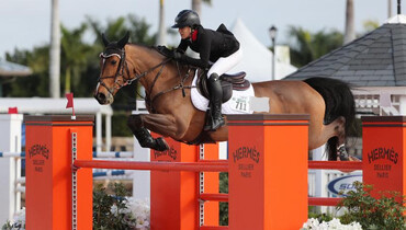 Lacey Gilbertson gallops to victory in $25,000 Hermès Under 25 Grand Prix at the 2018 Winter Equestrian Festival
