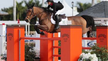 Lacey Gilbertson gallops to victory in $25,000 Hermès Under 25 Grand Prix at the 2018 Winter Equestrian Festival