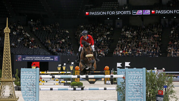 Beezie Madden with a rail in hand on the Longines FEI World Cup Final's overall standings