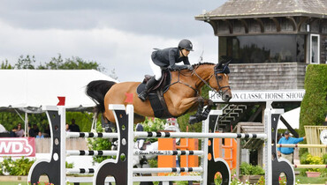 Adrienne Sternlicht wins by milliseconds in the $30,000 Land Rover Jumper Challenge presented by Jaguar, at the 44th Hampton Classic