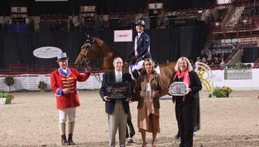 Molly Ashe Cawley takes top honors in the Grand Prix de Penn National at Pennsylvania National Horse Show