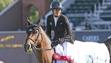Tiffany Foster and Brighton take first place in the RBC Capital Markets Cup at Spruce Meadows 'National'