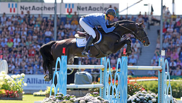 Christian Ahlmann and Solid Gold Z cut corners to win the 1.55m Allianz-Prize at CHIO Aachen