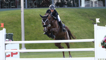 Natalie Dean wins the CSI3* Enbridge Grand Prix at Spruce Meadows
