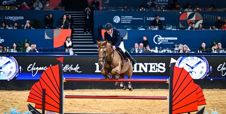 Roger Yves Bost and Ballerine du Vilpion win the Longines Grand Prix in Hong Kong