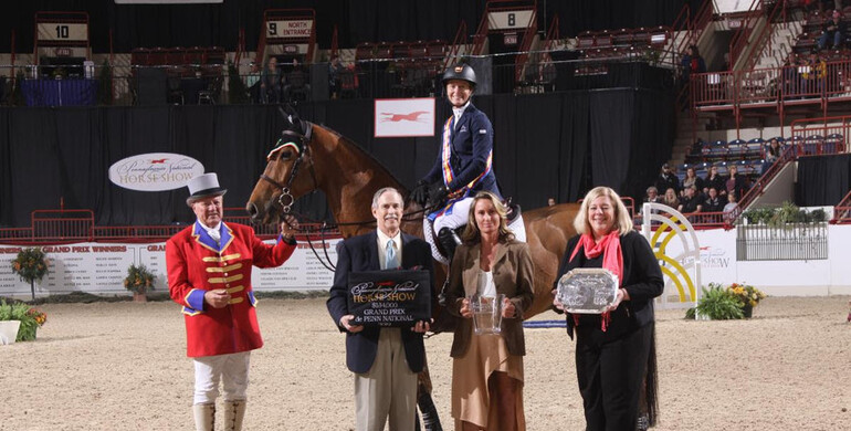 Molly Ashe Cawley takes top honors in the Grand Prix de Penn National at Pennsylvania National Horse Show