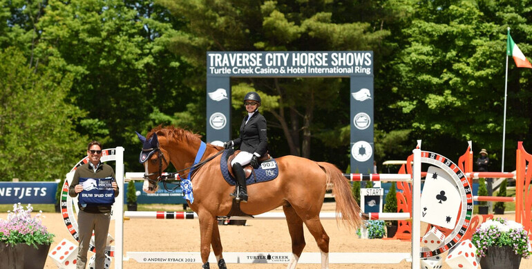 Margie Engle plays her Jackofhearts to kick off Traverse City Spring Horse Shows